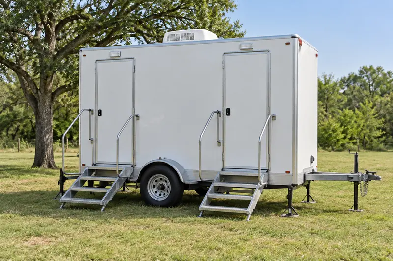 White restroom trailer with multiple entrances